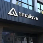 Modern 3D silver business logo and text reading amalisva mounted on dark slatted exterior building signage Brisbane.