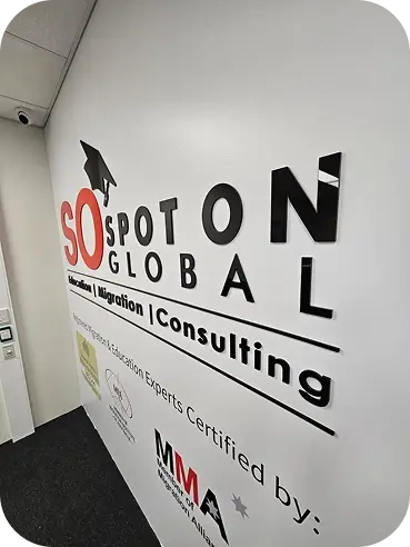 3D acrylic letters reading SPOT ON GLOBAL mounted on an interior office wall, showcasing interior commercial building signage.